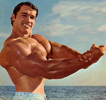 Idealized photo of young Arnold Schwarzenegger flexing muscles on a beach