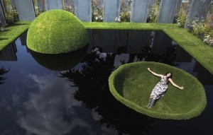 idyllic lawn grass sculptures at Hampton Court with girl