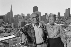 Milton and Rose Friedman pose on a balcony overlooking San Francisco