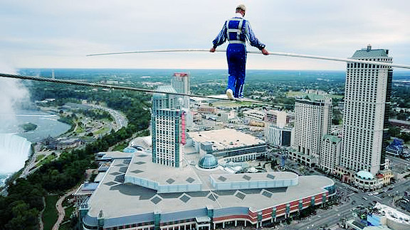a tightrope walker going a long distance between two skyscrapers