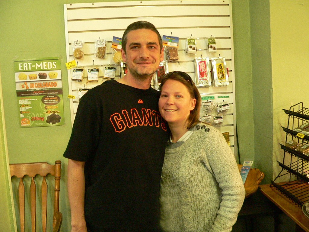happy couple in front of medibles at Mind Body Spirit dispensary