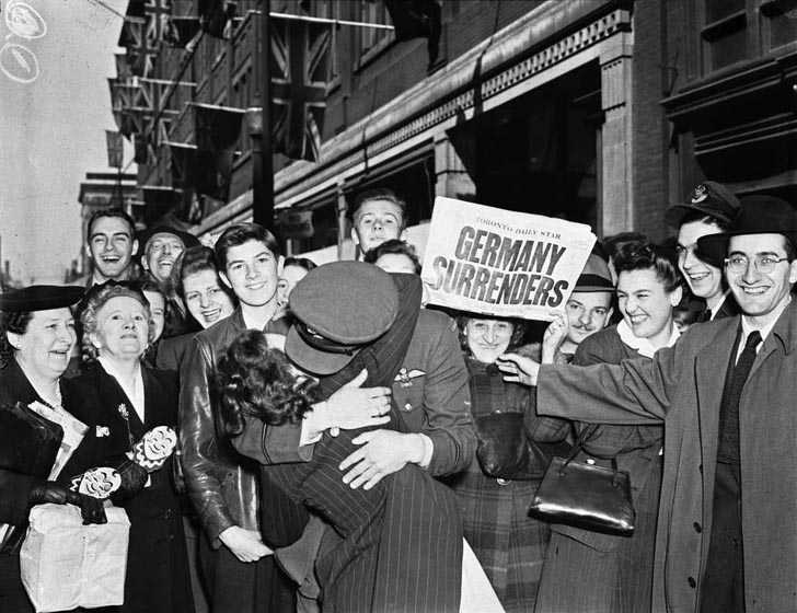 Soldier kissing girl on VE Day