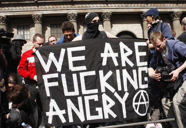 protestors outside G20 summit in London unveil banner saying "We are fucking angry"