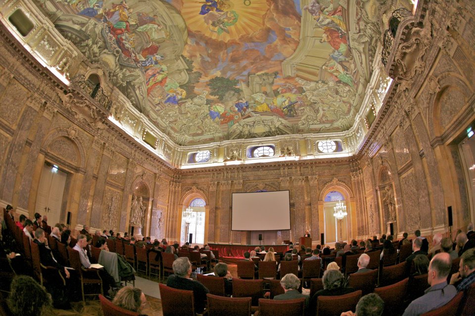 Austrian Economist Ludwig van Mises supporters gather under frescos in a gorgeous meeting room in Austria