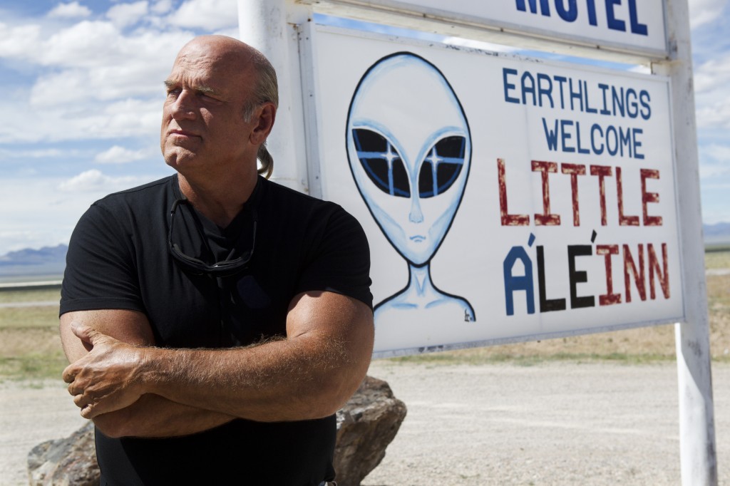 Governor Jesse Ventura in front of Alien billboard near Area 51