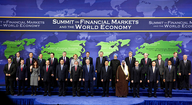 world economic leaders including George W. Bush pose at a summit of financial markets and the world economy