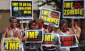 Protestors dressed as zombies protest the International Monetary Fund