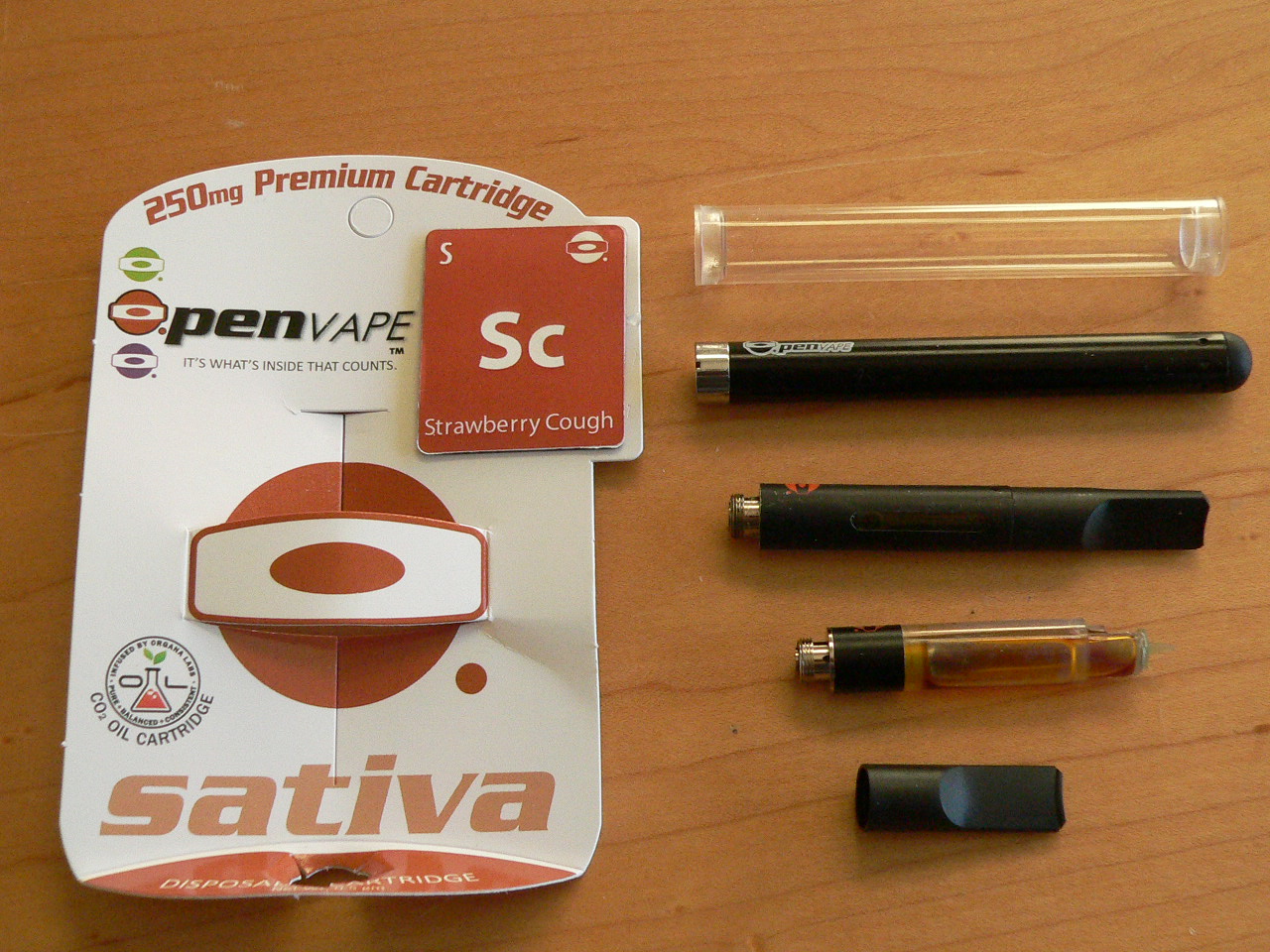 The O.Pen personal vaporizer and a Strawberry Cough vape cartridge.