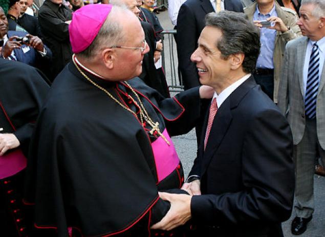 governor cuomo shaking hands with a Cardinal