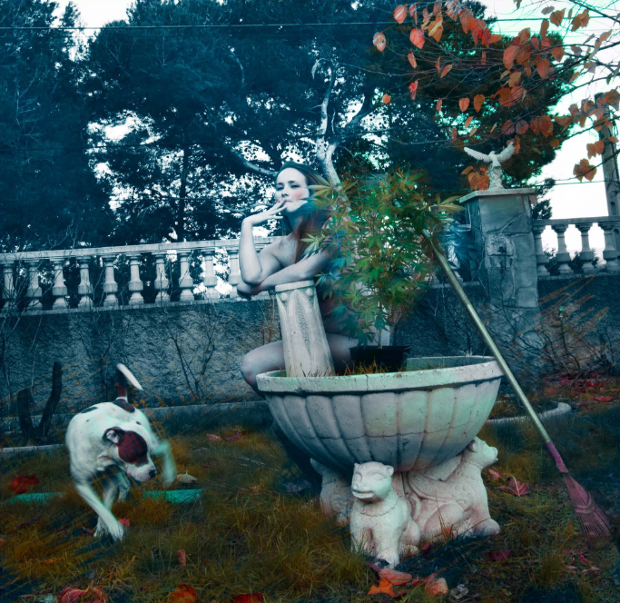 Woman with dog and pot plant in garden