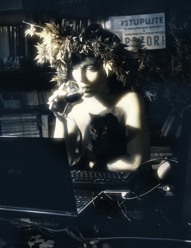 Girl with cat, typewriter and cannabis wreath